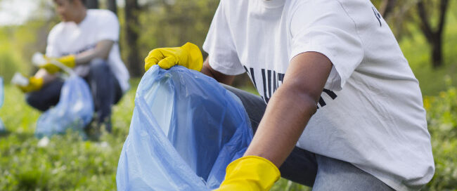 Young man collects litter