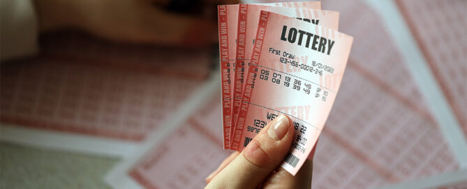 Person holding lottery tickets